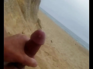 Seashore masturbation with cumshot.