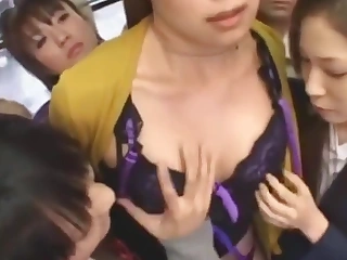 Lesbian Japanese have some fun on an obstacle bus
